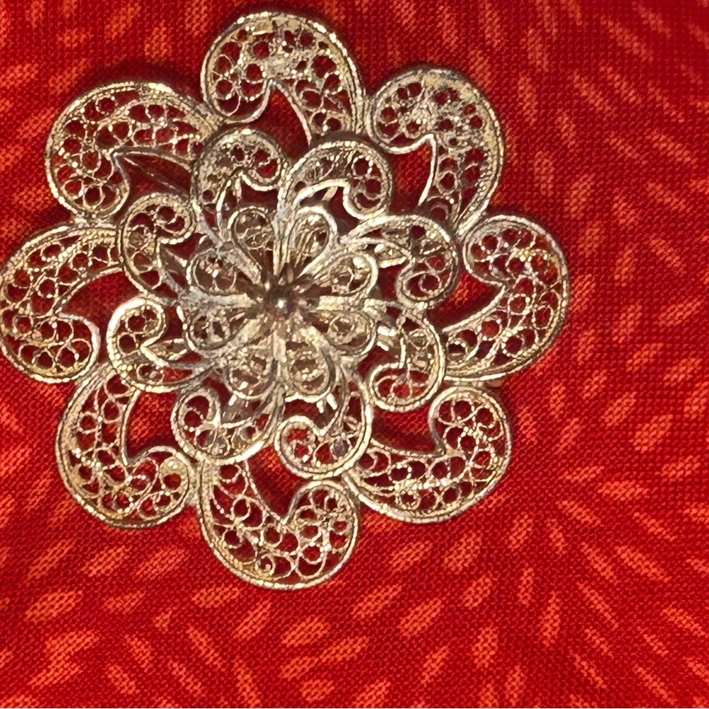 Vintage white filigree brooch pin.
